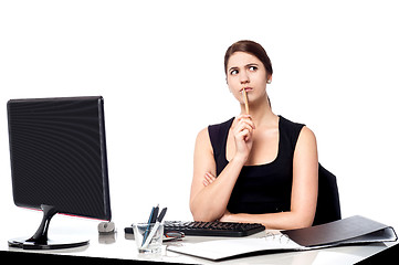 Image showing Lady thinking of a solution for client's query