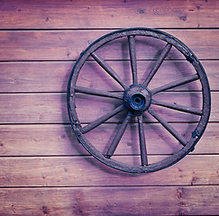 Image showing Vintage wooden wheel on wall