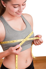 Image showing Woman Measuring Up Her Chest
