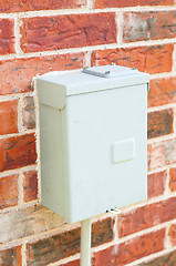 Image showing Electric control box on red brick wall