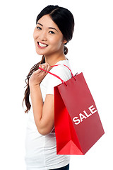 Image showing Cheerful young shopaholic girl