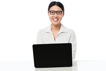 Image showing Smiling corporate lady with laptop