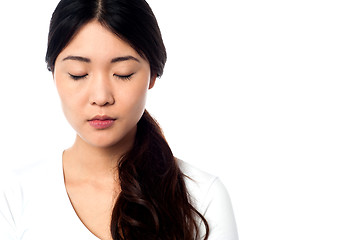 Image showing Young girl with closed eyes at peace