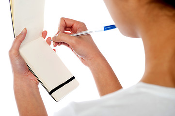 Image showing Waitress writing down customers order