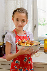 Image showing The girl with pies