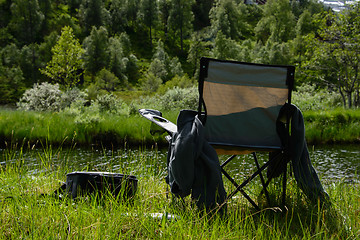 Image showing Fisherman's chair by a river