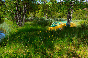 Image showing Rowboat under trees