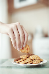 Image showing Taking cookie