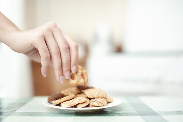 Image showing Taking cookie