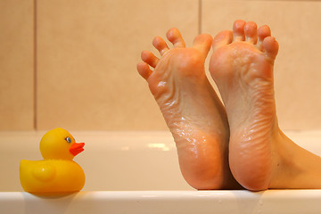 Image showing Bath duck meeting feet