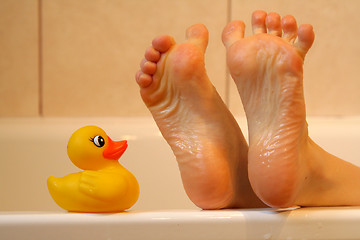 Image showing Bath duck meeting feet