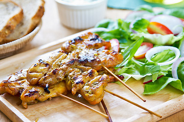 Image showing Grilled chicken skewer with salad