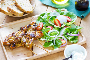 Image showing Grilled chicken skewer with salad