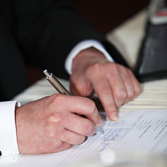 Image showing Man completeing a questionnaire