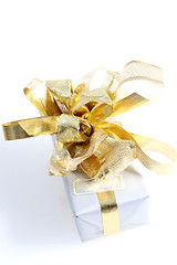 Image showing Gift with ornate gold bow