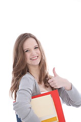 Image showing Happy young woman giving a thumbs up