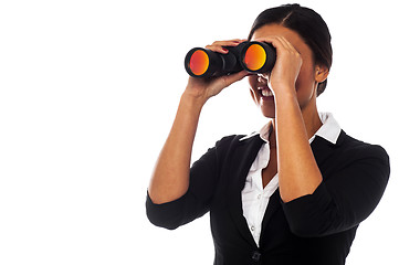 Image showing Corporate woman viewing through binoculars