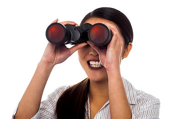 Image showing Corporate woman viewing through binoculars