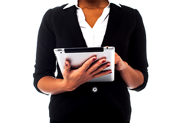 Image showing Cropped image of a woman holding touch pad