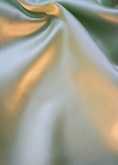 Image showing Smooth elegant green silk as background