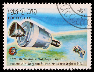 Image showing Stamp printed in Laos shows experimental flight of Soyuz and Apollo