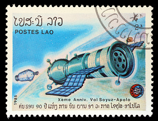 Image showing Stamp printed in Laos shows experimental flight of Soyuz and Apollo