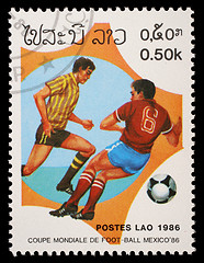 Image showing Stamp printed in LAOS shows the football Players