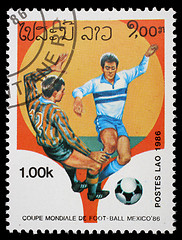 Image showing Stamp printed in LAOS shows the football Players