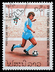 Image showing Stamp printed in LAOS shows the football Players