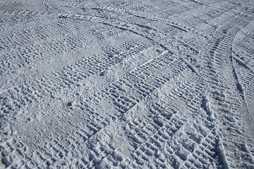 Image showing Vehicle tracks crossing the snowy terrain