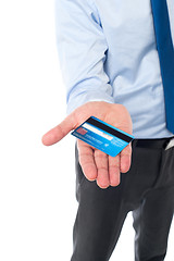 Image showing Businessman displaying his cash card