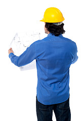 Image showing Construction worker with blueprint plan