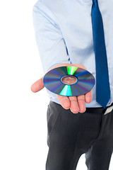 Image showing Man showing compact disc, cropped image