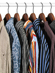 Image showing Colorful clothes on a rack