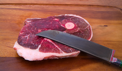 Image showing Raw meat with national uzbek knife