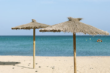 Image showing Thatch Beach Umbrellas