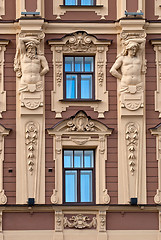 Image showing The facade of the building with antique sculptures.