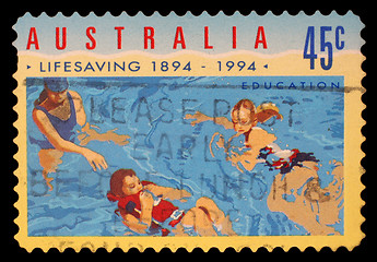 Image showing Stamp printed in AUSTRALIA shows the People in Water, Centenary of Organized Life-saving in Australia