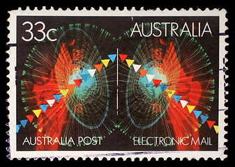 Image showing Stamp printed in Australia shows symbols of electronic mail