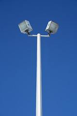 Image showing Stadium spotlights and the blue sky