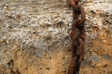 Image showing Rusty chain on a stone