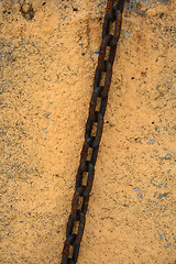 Image showing Rusty chain on a stone wall