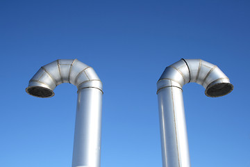 Image showing Two shiny metal ventilation pipes
