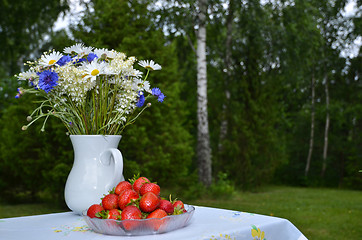 Image showing Summerflowers and strawberries