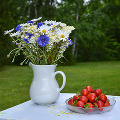 Image showing Strawberries and summer flowers