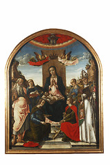 Image showing Madonna and Child on the throne crowned by two angels, with saints