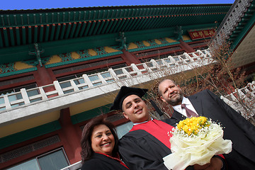 Image showing University graduate with his parents