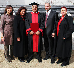 Image showing Happy university graduate with his parents. International studen