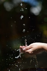 Image showing water stream on woman hand