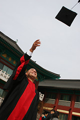 Image showing University graduate celebrates his success